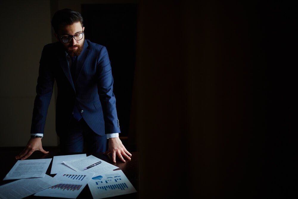 Pensive businessman in the workplace